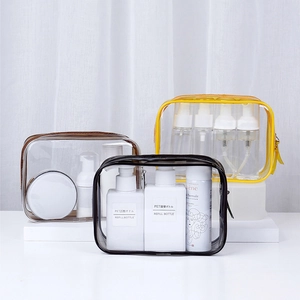 Transparent PVC waterproof cosmetic bag with black, brown, and yellow trims for travel