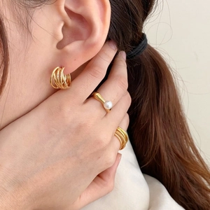Elegant 925 sterling silver woven gold earrings and pearl ring set on model