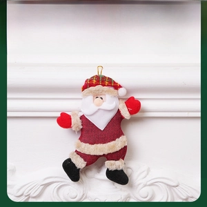 Detail of Santa Claus plush hanging ornament with red burlap fabric and faux fur trim