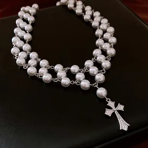 Elegant layered pearl necklace with a shimmering zircon cross pendant for women
