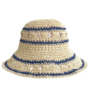 Foldable beige straw sun hat with navy blue stripes and breathable woven texture