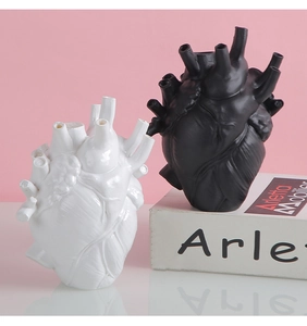 Macro detail of anatomical heart vase showing realistic muscle textures and multiple ports