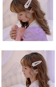 Detail of elegant white pearl hair clip with openwork design worn by a female model