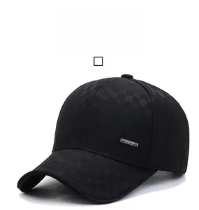 Detailed view of black baseball cap with subtle checkerboard texture and metal accent