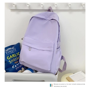 Close-up of a lilac large-capacity backpack with durable nylon fabric and front pocket