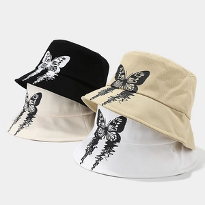 Streetwear cotton bucket hats in black, beige, and white with butterfly print design