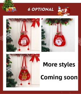 Detail of Christmas candy bags featuring 3D Santa, snowman, and reindeer doll decorations
