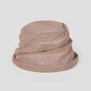 Detail of a lightweight lace bucket hat featuring a ruffled brim and khaki woven texture
