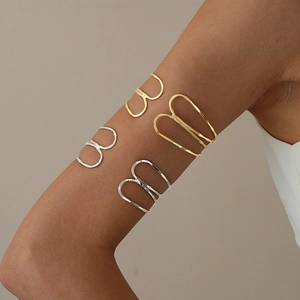 Minimalist multi-layer geometric metal upper arm cuffs in polished gold and silver finishes