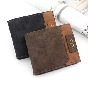 Close-up of black and dark brown men's bifold leather wallets with contrast stitching