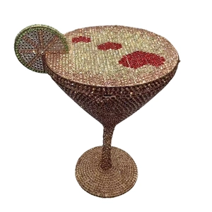 Detailed view of cocktail glass clutch with red crystals and lemon slice detail