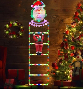 Detailed view of LED Santa climbing ladder with Merry Christmas sign for garden decor