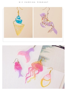 Detail of glitter resin ocean pendants in seashell, fish tail, and jellyfish shapes