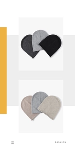 Detail view of multicolored knit beanies featuring soft rabbit hair blend and rolled edges