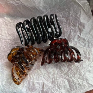 Three large PC pumpkin hair claw clips in classic black and tortoiseshell pattern