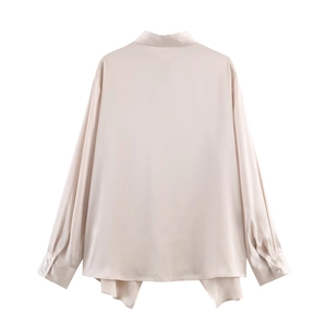 Elegant champagne satin shirt featuring a long sleeve design and unique asymmetrical hem back