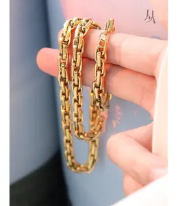Detail shot of heavy square link chain necklace in 18K gold plated steel with lobster clasp