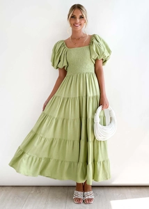 Detail of green off-shoulder tiered midi dress with puff sleeves and smocked bodice
