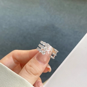 Detailed close-up of S925 sterling silver ring with three rows of sparkling zircons