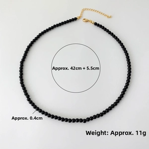 Detail view of 0.4cm black onyx beaded necklace with gold lobster clasp and extension chain