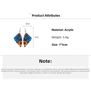 Detail view of colorful acrylic butterfly wing earrings showing 7x3cm size and 5.8g weight