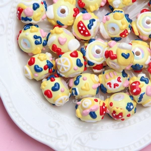 Colorful hand-painted DIY craft beads with hearts and clouds for jewelry making