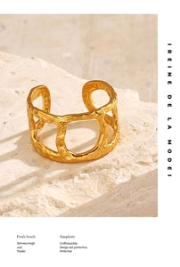 Detailed view of 18K gold plated ring with hammered texture and hollow geometry design