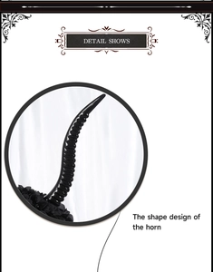 Detail view of black spiral gothic horns showing the glossy texture and intricate shape