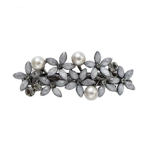 Elegant silver flower hair clip with frosted texture, rhinestones and pearls on white base
