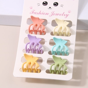 Detailed set of 6 matte macaron butterfly hair clips on a white fashion jewelry card