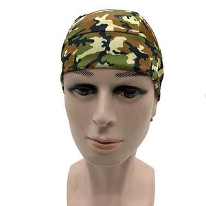 Detail of outdoor cycling cap in jungle camouflage pattern with reinforced edge stitching