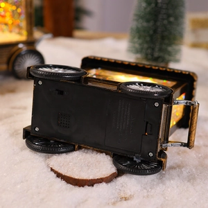 Close-up of vintage Christmas light base showing the power switch and battery compartment
