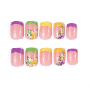 Short French glossy press-on nails featuring floral designs in pastel purple and yellow