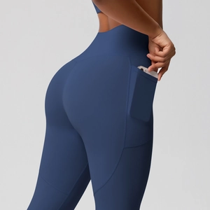 Close-up of navy blue high-waisted yoga leggings with a functional side phone pocket