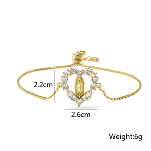 Detail of gold Virgin Mary heart pendant with cubic zirconia and adjustable chain
