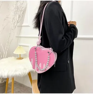 Pink heart-shaped PU bag featuring a unique liquid flow design and silver metal chain