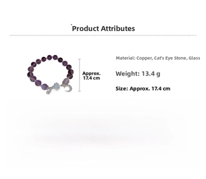 Detail of beaded bracelet with purple amethyst style beads and crescent moon pendant