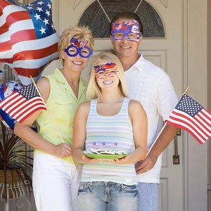Family wearing 4th of July party glasses with USA and Love motifs for independence celebrations
