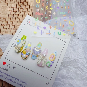 Close-up of 5D embossed nail stickers featuring 3D rabbits, pearls and colorful bows
