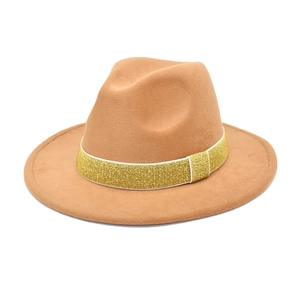 Detail view of camel wool fedora hat featuring a gold sequin ribbon band and wide brim