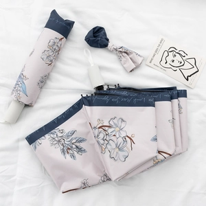 Floral automatic folding umbrella set with matching sleeve and ribbon accessory