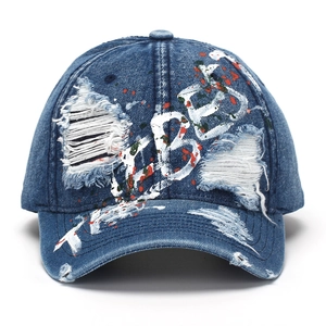 Distressed denim baseball cap with graffiti paint splatters and LIBER embroidery