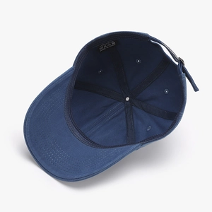 Internal view of navy blue washed cotton baseball cap with six-panel structure and metal buckle