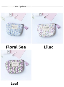 Detailed view of quilted floral coin purses with tassel zippers in three distinct patterns