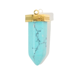Detailed view of a hexagonal turquoise pendant with an engraved gold metal cap and loop