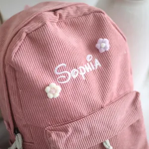 Pink corduroy backpack with personalized Sophia embroidery and floral details for students