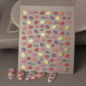 Macro view of 3D lip nail art stickers with metallic gold and red lips style Co-262
