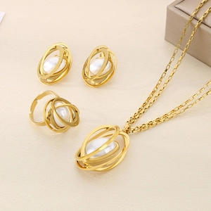 Detailed set of gold titanium steel jewelry featuring elegant white pearl geometric motifs