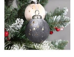 Close-up of velvet Christmas balls with gold stars, champagne and grey festive ornaments