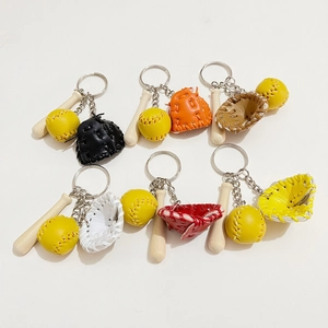 Detailed overhead view of 3-in-1 baseball keychains with mini bat, ball and colorful glove